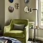 Family Fun Meets Moody Members Club | Armchair with floor lamp. | Interior Designers